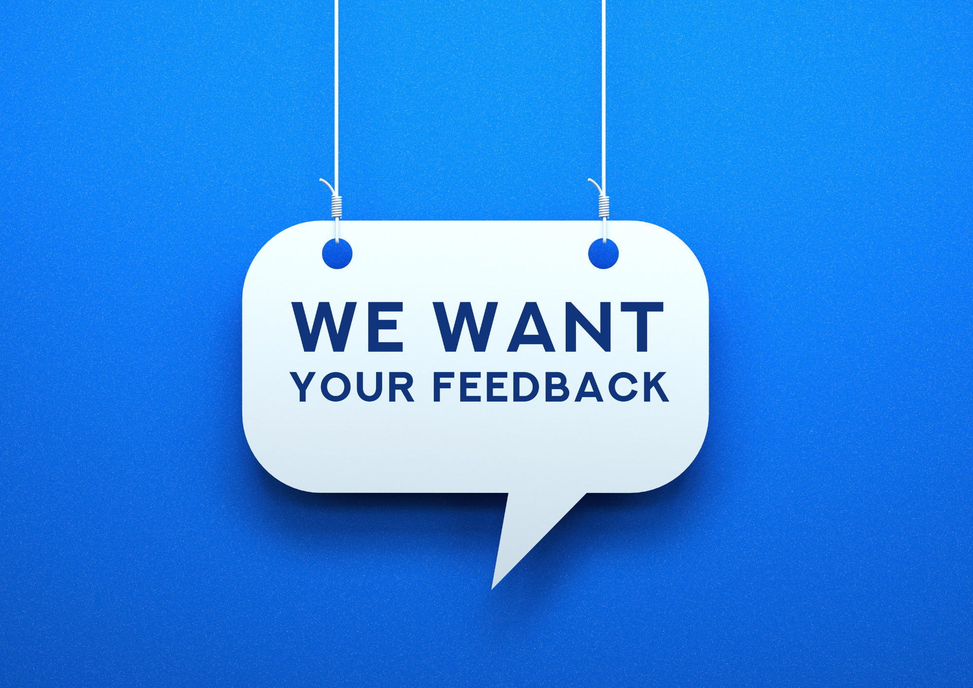 Speech Bubble hanging on a blue background with the text "We want your feedback"